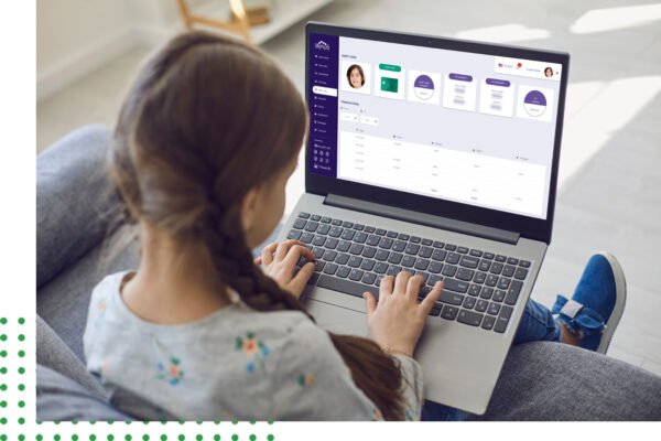 A young girl working at her laptop and analyzing dashboard