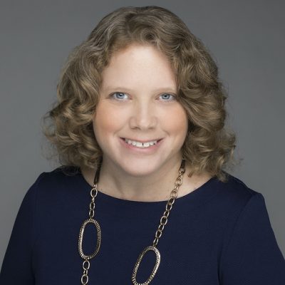 A woman's picture smiling at camera